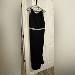 Stunning maxi dress adorned with elegant silver trimming.